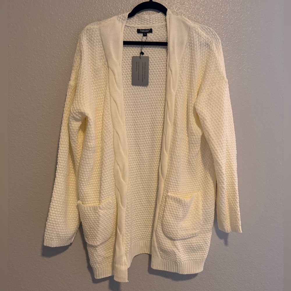 Cream cardigan, never worn. Oversized look.